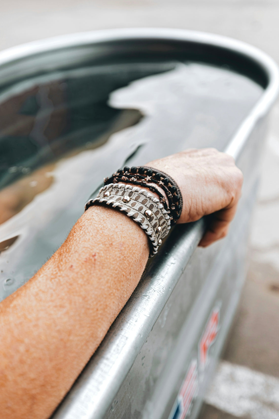 person wearing silver link bracelet