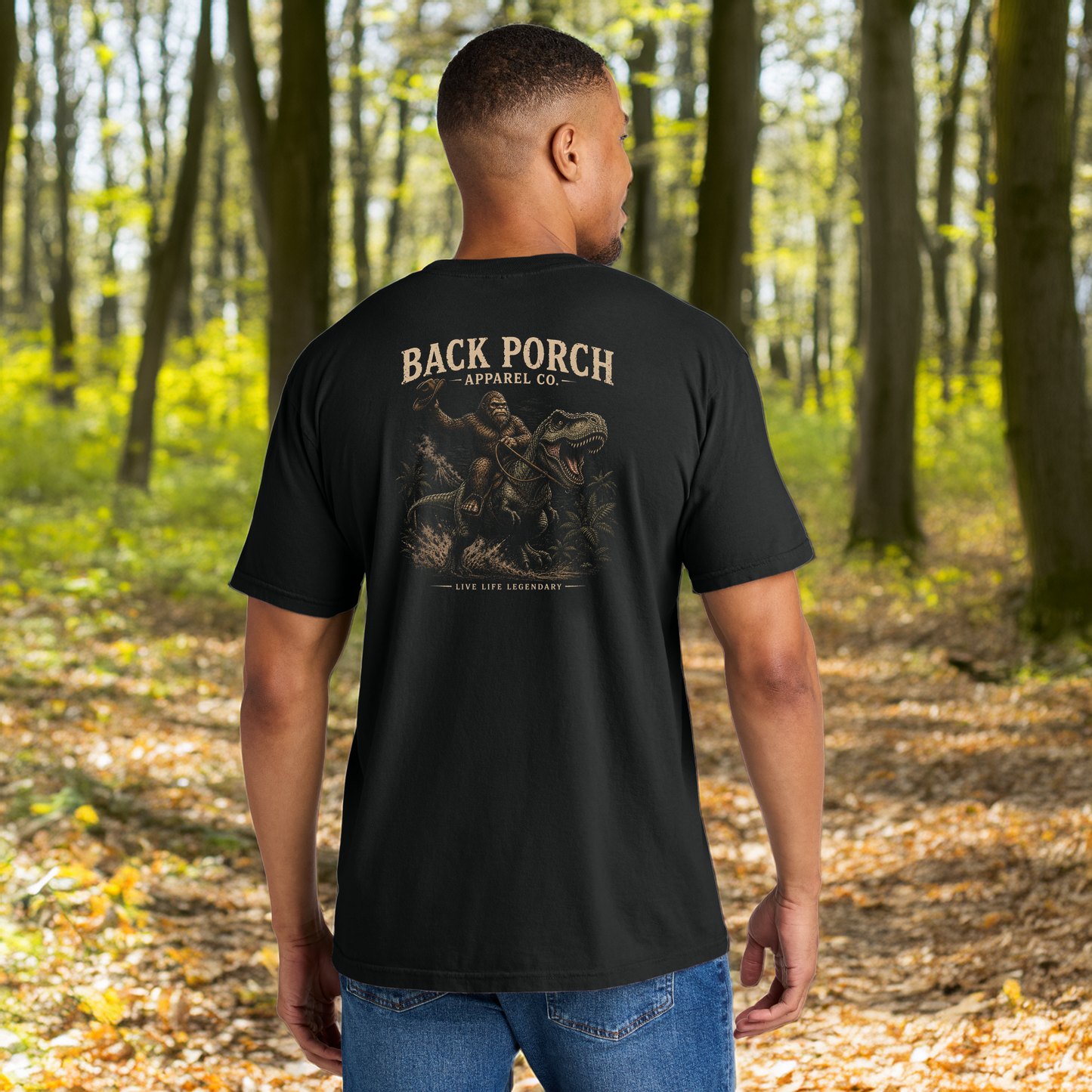 Back Porch Apparel Bigfoot Riding T-Rex Comfort Colors Graphic Tee