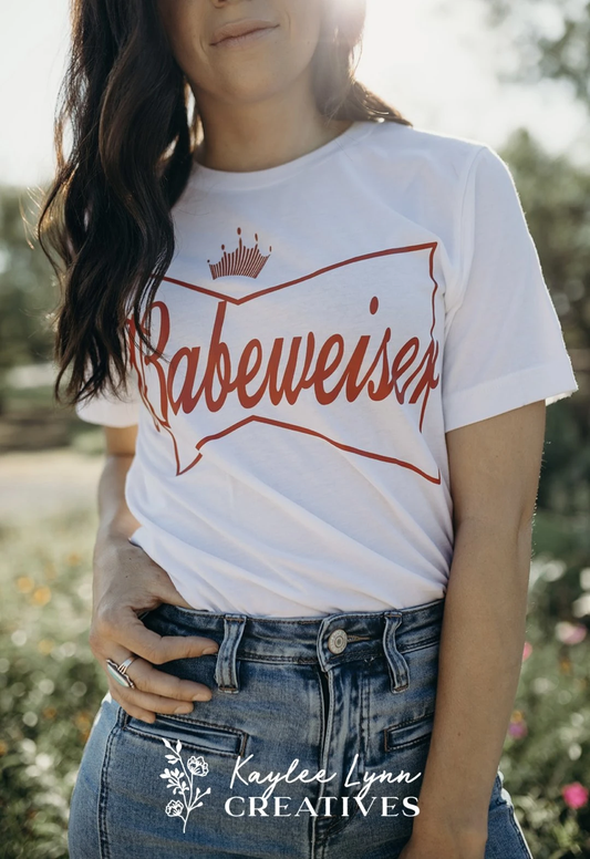Babewiser Parody Logo Graphic on Gildan Softstyle White Shirt – Graphic Tee, Long Sleeve & Crewneck.