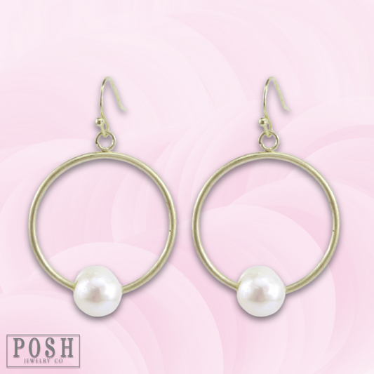 Gold circle earring with pearl charm