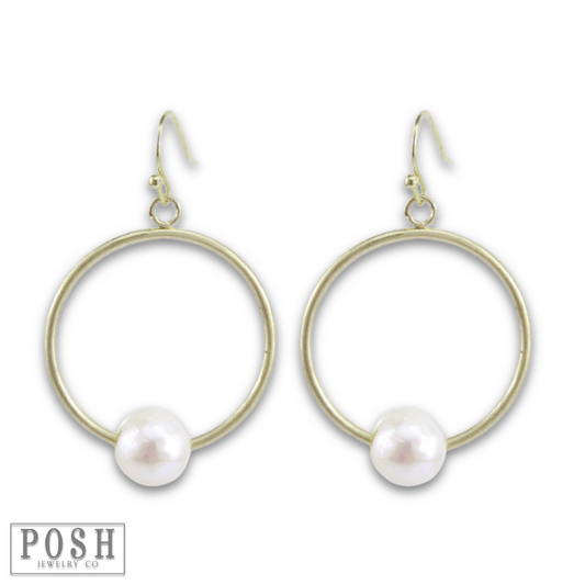 Gold circle earring with pearl charm